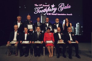 Assembled together, all the BC Dental Association award winners with BC Dental Association representatives at the 13th Annual Toothfairy Gala on March 9, 2013 at the Vancouver Convention Centre. Top row from left to right: Drs. Richard Wilczek, President of the BC dental Association; Robert McDougall; Ken Lee; Jim Gray; Charles Shuler and Ms. Jocelyn Johnston, Executive Director, BC Dental Association. Bottom row from left to right: Drs. Jim Guild, Ken Stones, Christopher Zed, Saida Rasul, Robert Priddy and Doug Johnston.