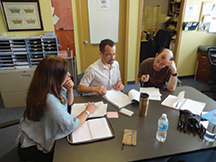 Drs. Mario Brondani (C) and Leeann Donnelly meet with Paul Kerston at the Positive Living Society of BC offi ce on Seymour Street in Vancouver.
