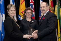 Dr. Miriam Rosin (L) and Dr. Michele Williams (C) 
 receive the CDA Oral Health Promotion Award.